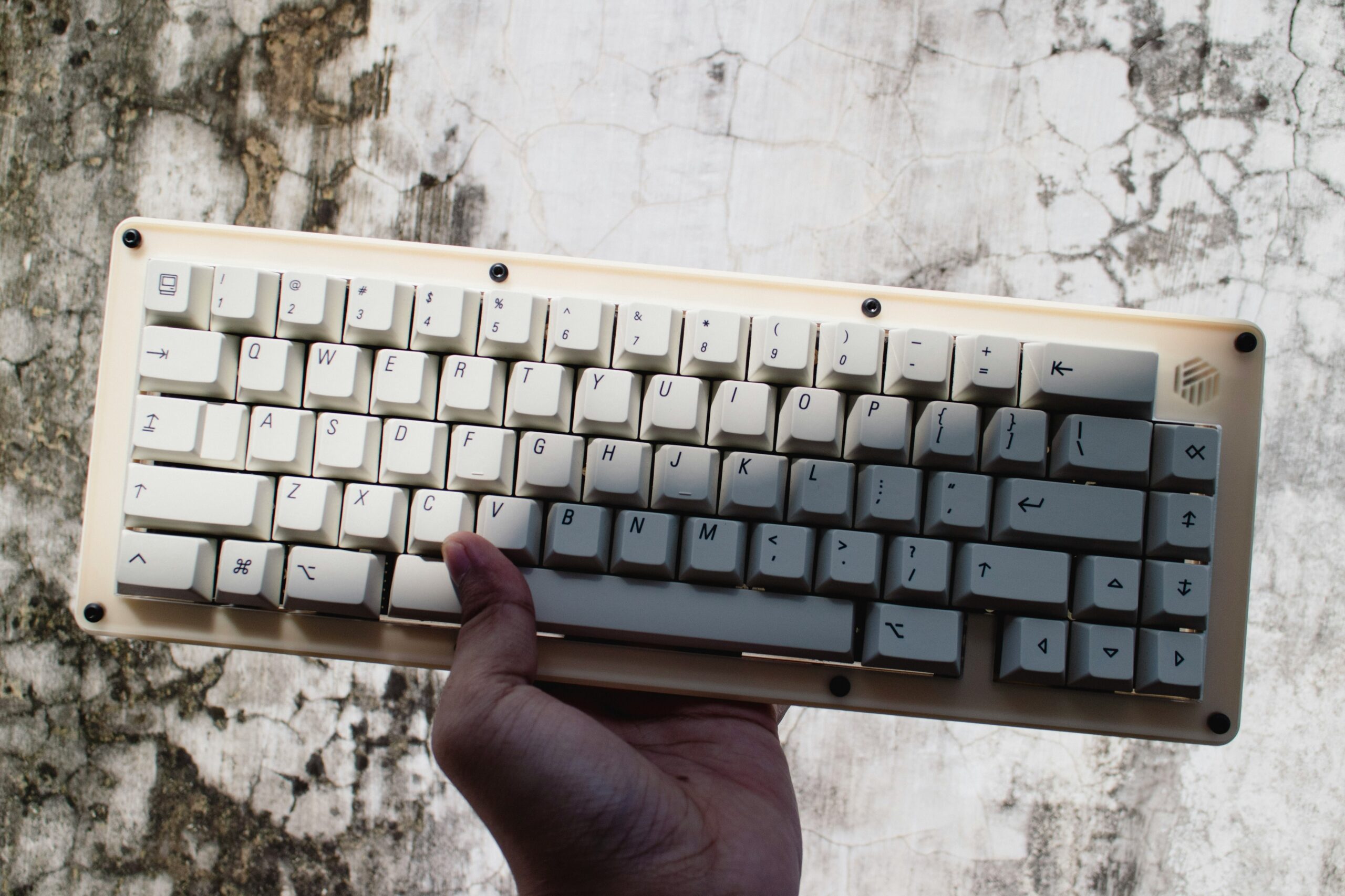 Hand holding up a keyboard